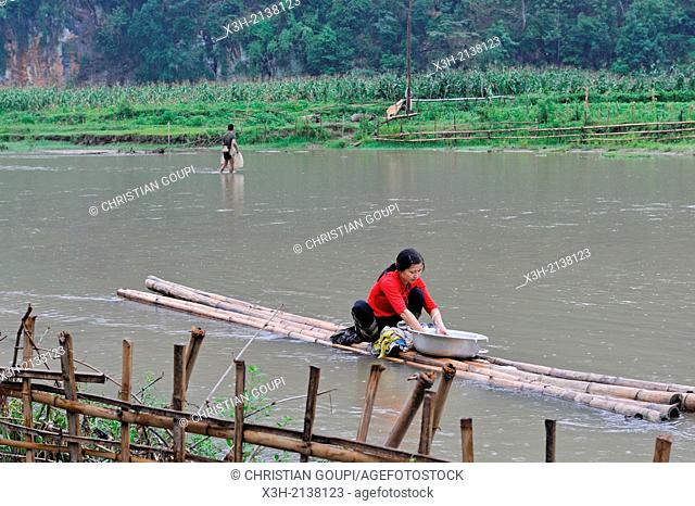 woman doing washing on the lakeshore, Ba Be Lake, Bac Kan province, Northern Vietnam, southeast asia
