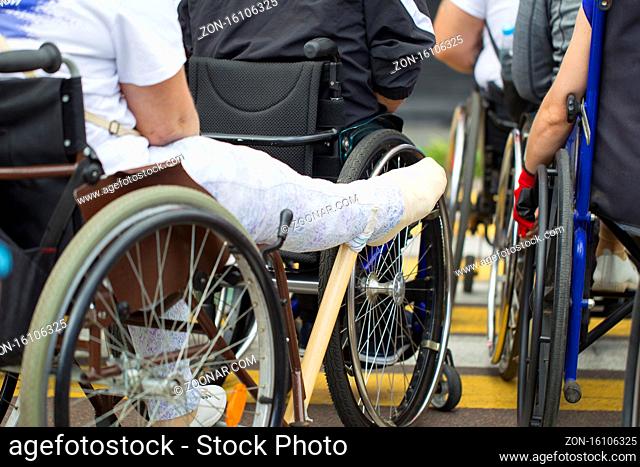 Man with gypsum in a wheelchair