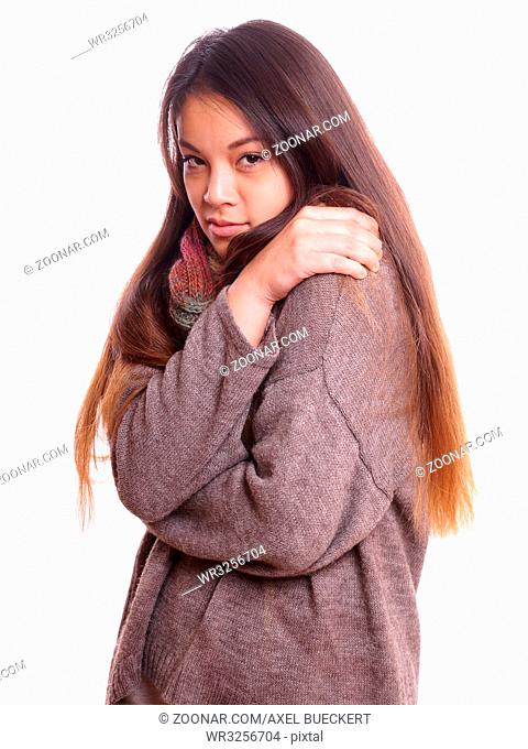 freezing young asian woman wearing wool sweater and scarf