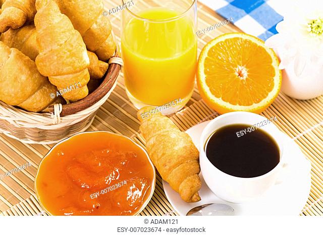 continental breakfast: coffee, strawberry, croissant and juice