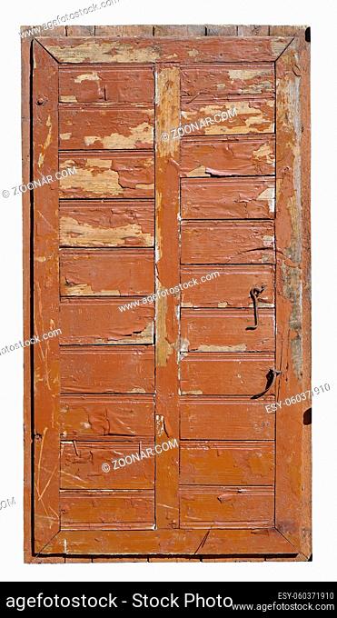 The aged broken wooden door of the ruined rural barn was painted in brown. Isolated on white