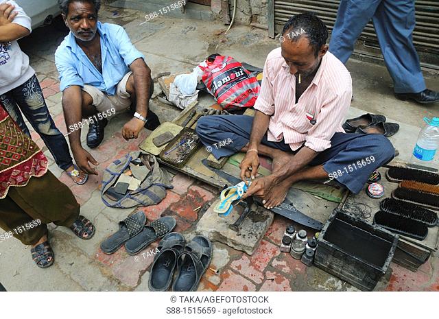 Man repair shoos everyday on the street