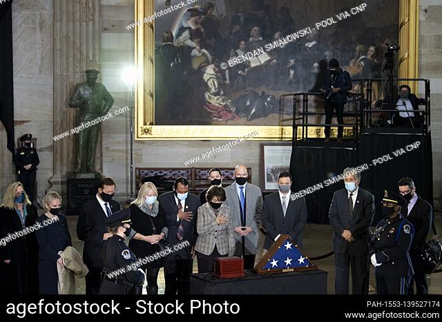 Lawmakers pay respects at the remains of Capitol Police officer Brian Sicknick lay in honor in the Rotunda of the US Capitol building after he died during the...