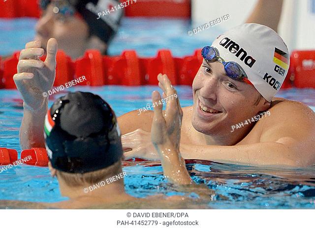 Marco Koch (R) of Germany and Daniel Gyurta of Hungary shake hands after the men's 200m Breaststroke semifinal of the 15th FINA Swimming World Championships at...