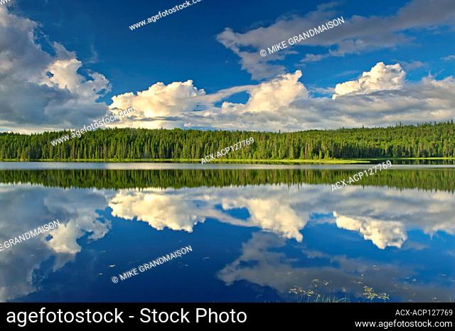 Clouds reflected in Trail Lake, Hwy 105 North of Vermillion Bay, Ontario, Canada