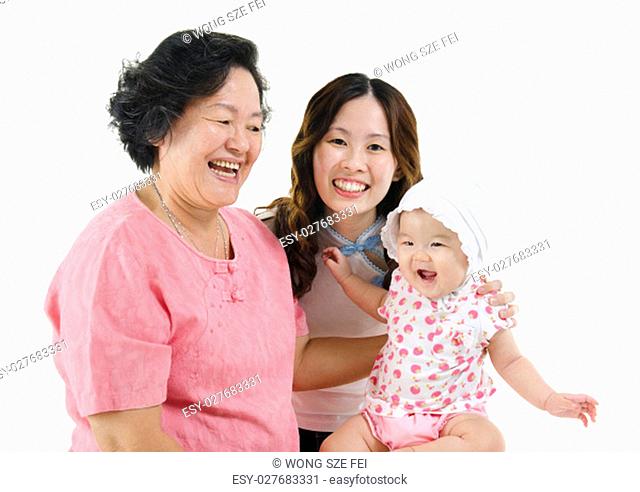 Portrait of happy three generations Asian family, senior woman, adult daughter and baby girl, isolated on white background