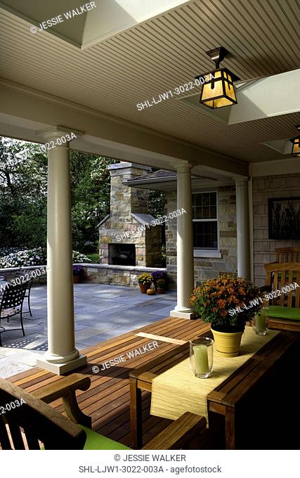 PATIOS: covered porch/ deck area with teak furniture, Arts and Crafts outdoor lighting, skylights in the roofof the porch, classic columns