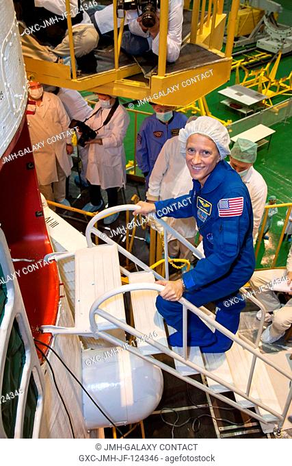 At the Baikonur Cosmodrome in Kazakhstan, Expedition 3637 Flight Engineer Karen Nyberg of NASA boards the Soyuz TMA-09M spacecraft in the Integration Facility...