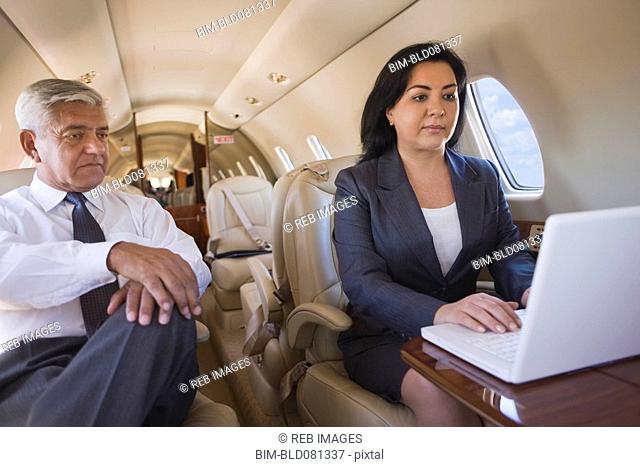 Business people working on private jet