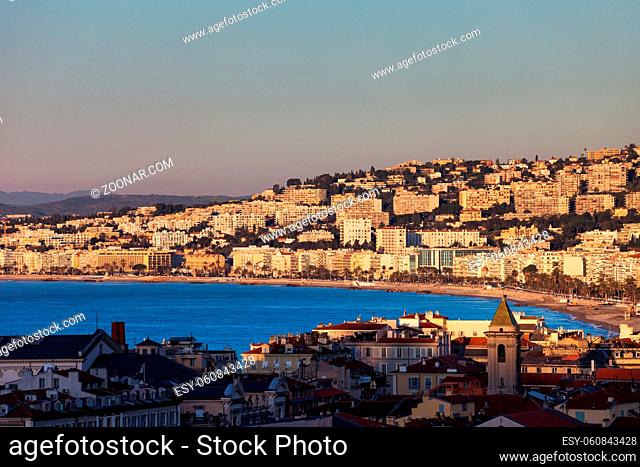 Nice city at sunrise in France, French Riviera (Cote d'Azur) cityscape with sea bay