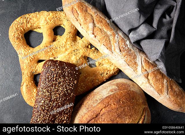 close up of different bread on kitchen towel