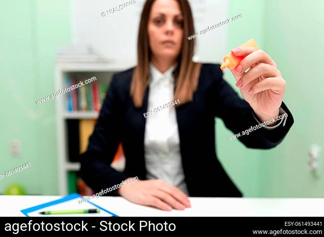 Businesswoman Holding Marker With One Hand And Pointing Important Ideas