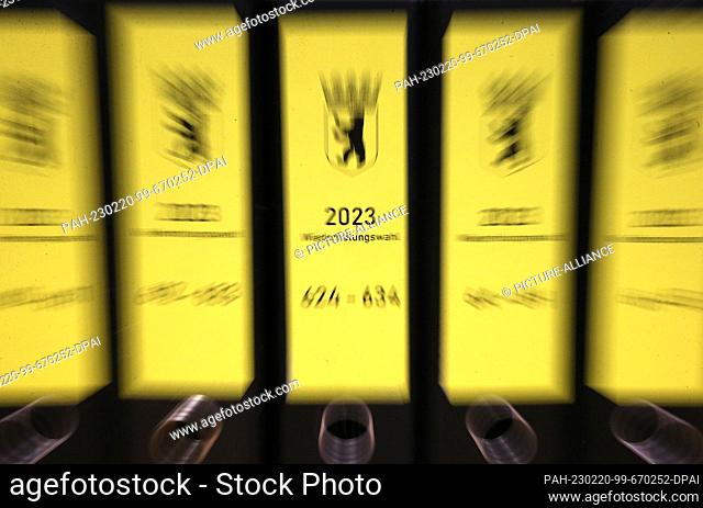 20 February 2023, Berlin: Folders of election documents stand on a table in the Lichtenberg district before the district election officer announces the official...