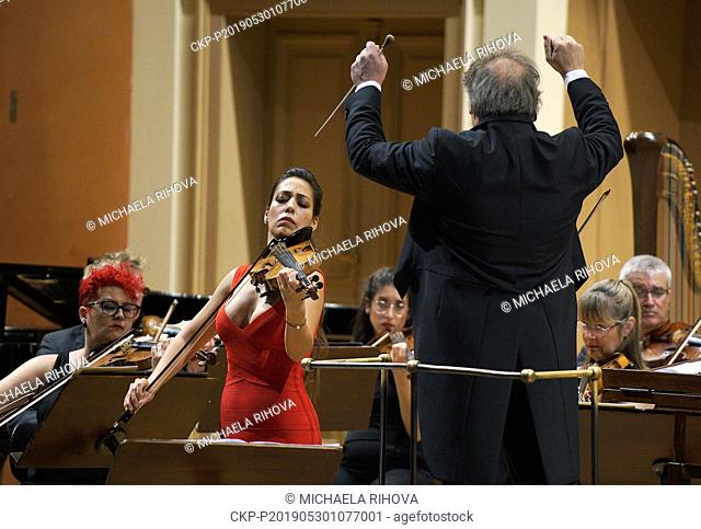 Spanish conductor Jaime Martin leads Orquestra de Cadaques together with star violinist Leticia Moreno (in red) on Prague Spring International Music Festival in...