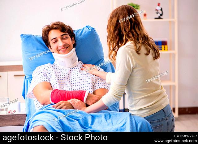 Loving wife looking after injured husband in hospital