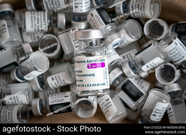 22 March 2021, Saxony, Leipzig: An empty vaccine ampoule of the company AstraZeneca lies on empty ampoules of the company Biontech/Pfizer (Comirnaty)
