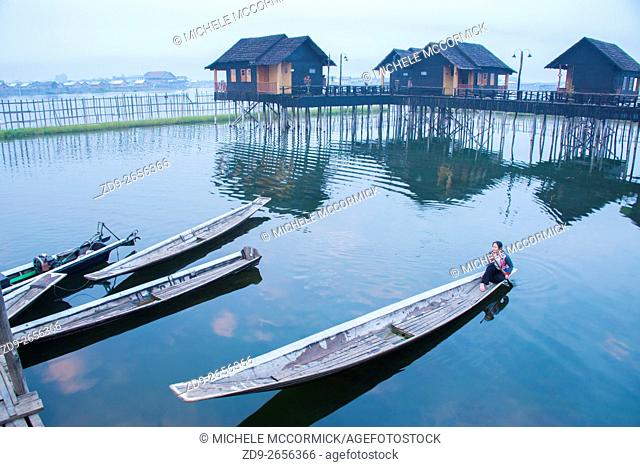 An early morning boater sets out from Garden Island Cottages at Inle Lake