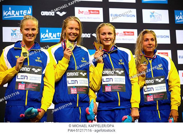Michelle Coleman (L), Magdalena Kuras (R), Louise Hansson (2-L) and Sarah Sjoestroem (2-R) of Sweden pose with their gold medal after winning the Women's 4X100m...