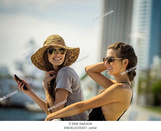 Caucasian women leaning on railing