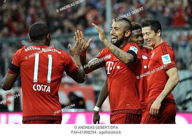 Munich's Douglas Costa (l-r), Arturo Vidal, David Alaba and Robert Lewandowski celebrate the 2-1 goal during the German Bundesliga soccer match between FC...