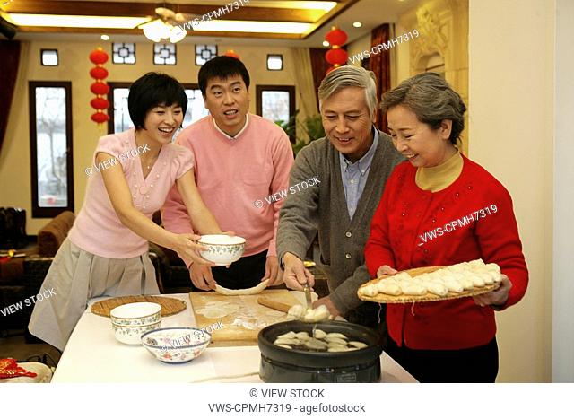 Chinese family making Chinese dumpling on New Year's Eve