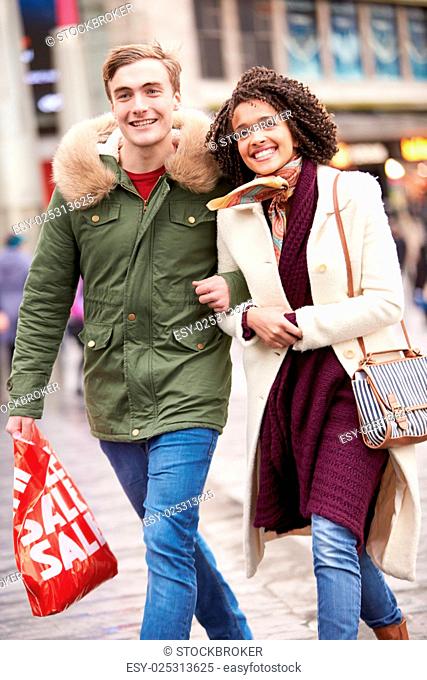 Young Couple Shopping Outdoors Together