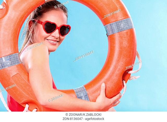 Happy woman in sunglasses with ring buoy lifebuoy