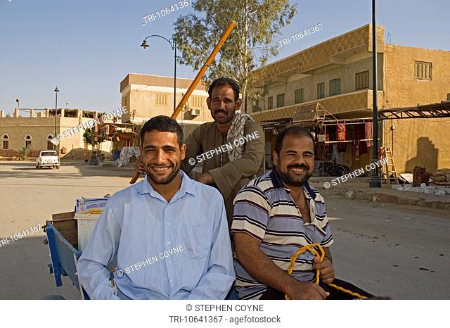 NORTH AFRICA, EGYPT, Siwa Oasis, Shali, main street, three Arab driving donkey and cart