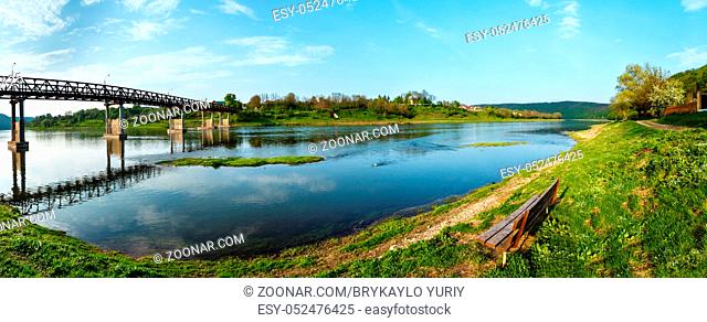 Spring picturesque view of the Dnister river with bridge. Nezvysko village, Ternopil region, Ukraine. Three shots stitch panorama