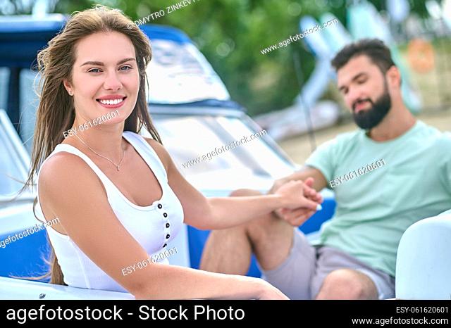 Couple in a boat. A man and a woman sitting in a boat