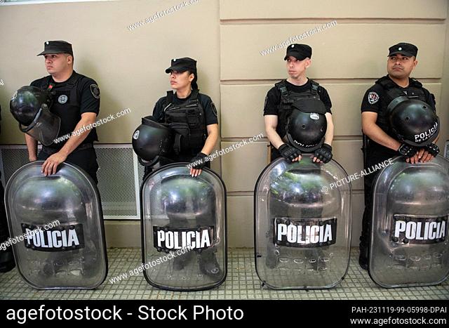 19 November 2023, Argentina, Buenos Aires: Police officers stand at the Almagro campus of the National Technological University