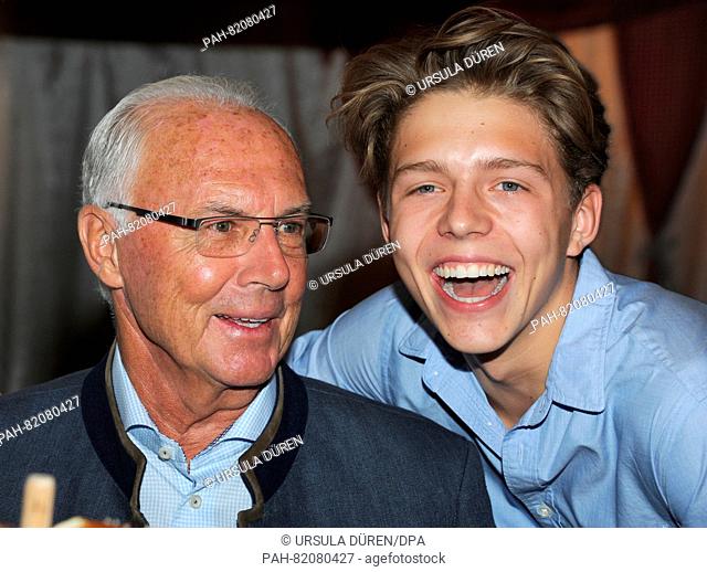 Franz Beckenbauer and his son Joel pose at the get-together of the Bavarian evening in the context of the 29th Kaiser Cup golf tournament of the...