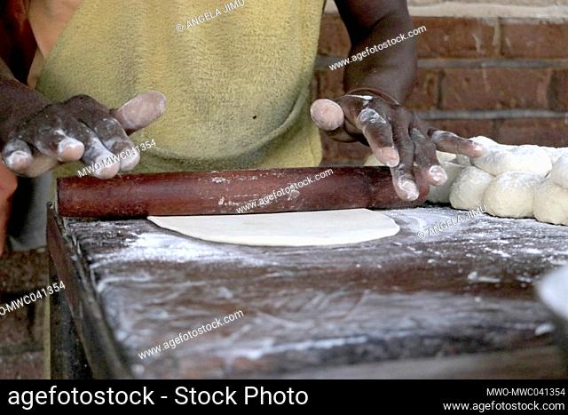 A man makes 'chapati' an Indian type bread in Dzaleka Refugee Camp. Dowa, Malawi