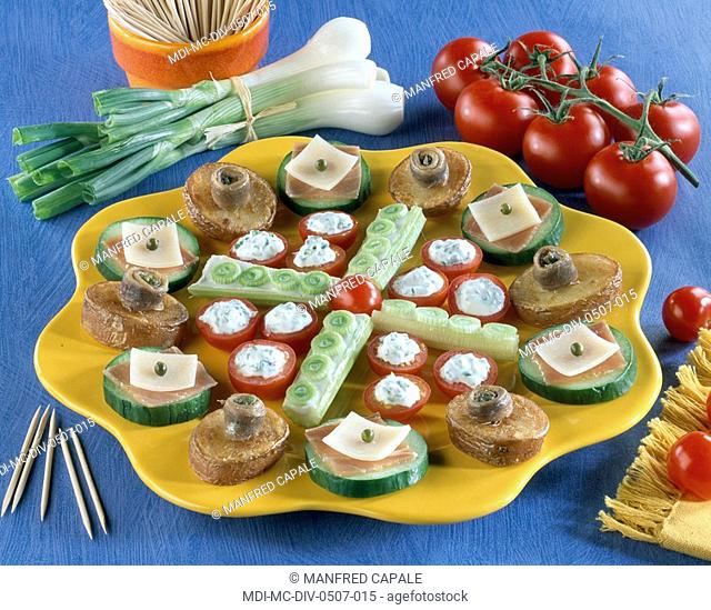 Petits fours - Cherry tomatoes and cheese - Potatoes and anchovies - Cucumber, country ham and cheese - Cucumber and onion