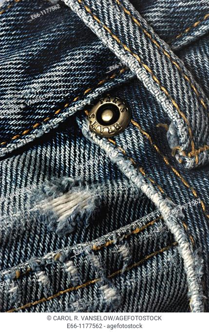 Five-pocket jeans, close-up - showing belt loop, front pocket and fifth pocket  Denim is faded and worn