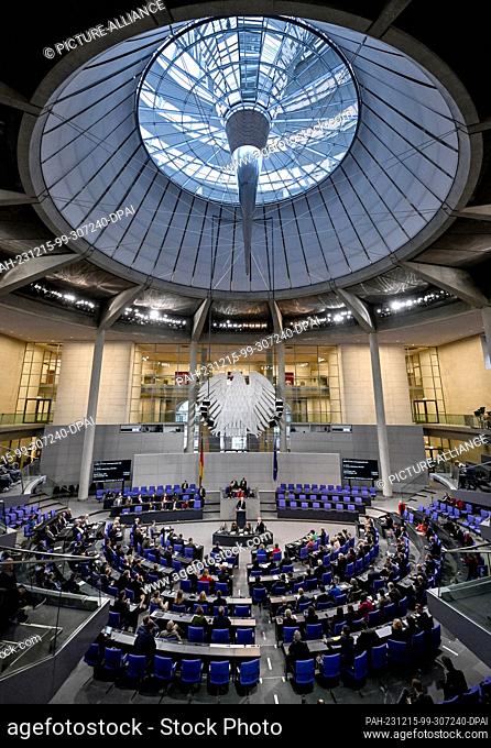 15 December 2023, Berlin: MPs sit in the plenary chamber of the Bundestag. The agenda includes the debate on the planned supplementary budget for the current...