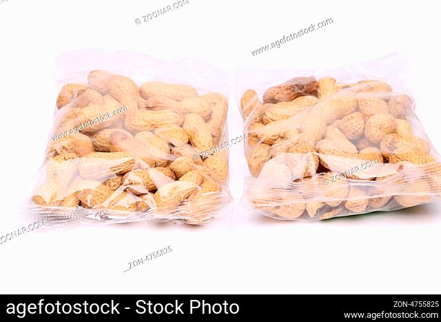 Two large plastic bags of peanuts