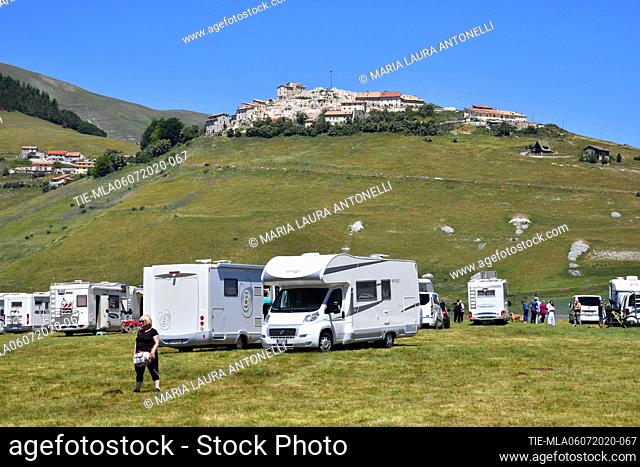 Campers of tourists invade the streets of the lentils bloom plain , Castelluccio di Norcia (Perugia) ITALY-07-07-2020