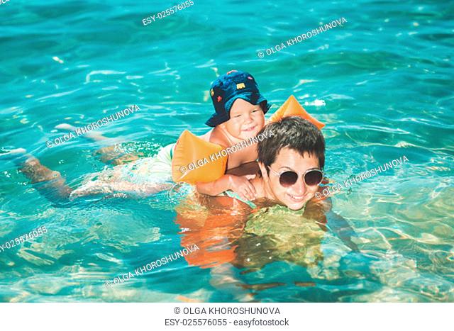 Baby and mother in a sea