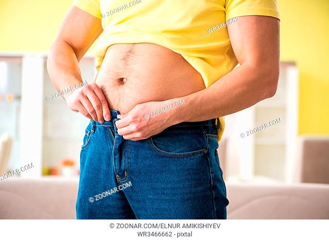 Young fat man in dieting concept