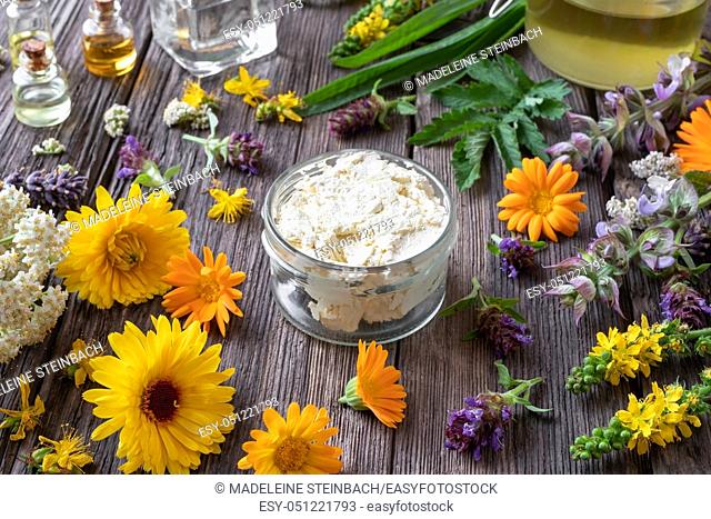 Homemade skin cream made from shea butter, medicinal herbs and essential oils