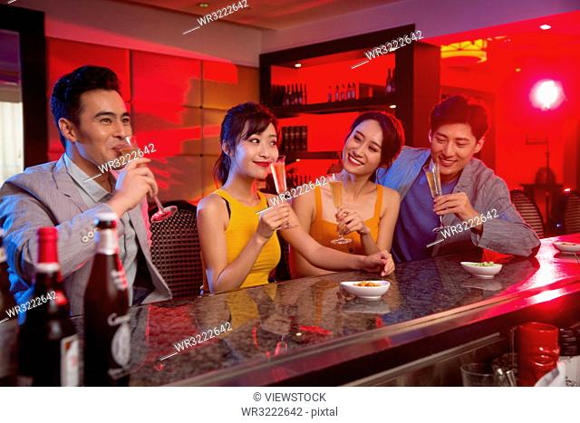 Young people drink in the bar