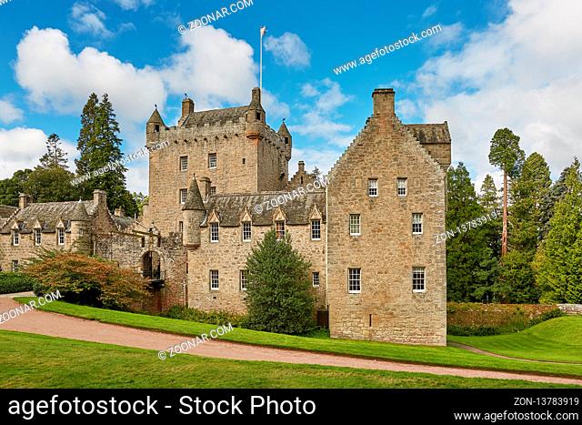 CAWDOR, NAIRN, SCOTLAND, UK - AUGUST 07, 2017: Front of Cawdor Castle with turret and drawbridge with bell and Stags Head Buckel Be Mindfull emblem