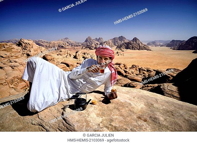 Jordan, Wadi Rum desert, protected area listed as World Heritage by UNESCO, Bedouin having a tea break at the top of mount Jebel Burdah