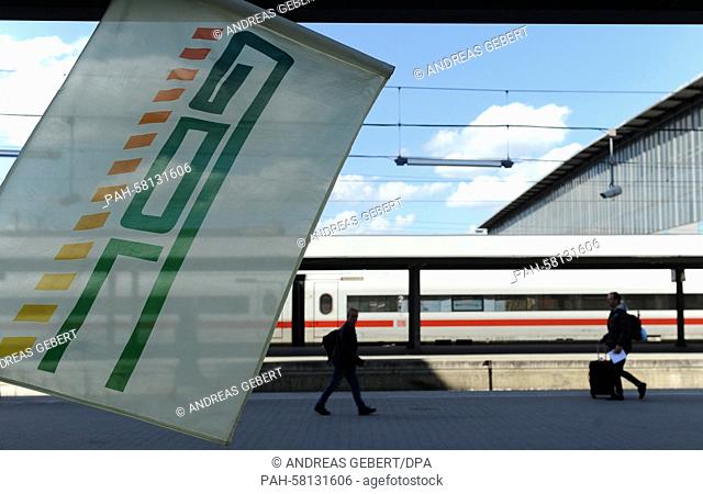 A flag of German train drivers' union GDL blows in the wind in front of an InterCityExpress (ICE) train after a strike rally at the main railway station in...