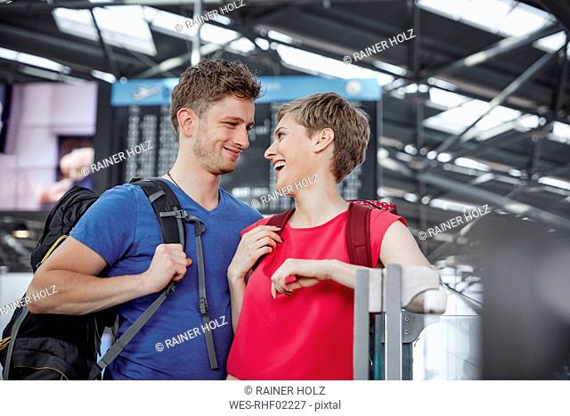 Happy couple at the airport