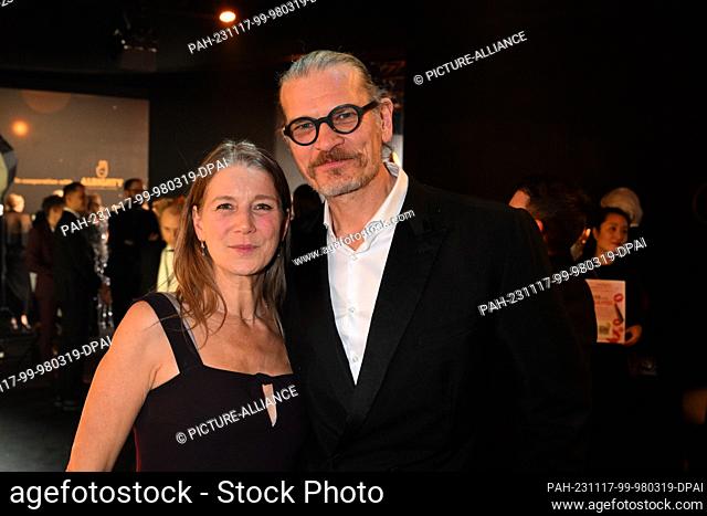 17 November 2023, Bavaria, Munich: Actor Götz Otto and his wife Sabine celebrate after the Bambi award ceremony at the Bavaria-Film premises