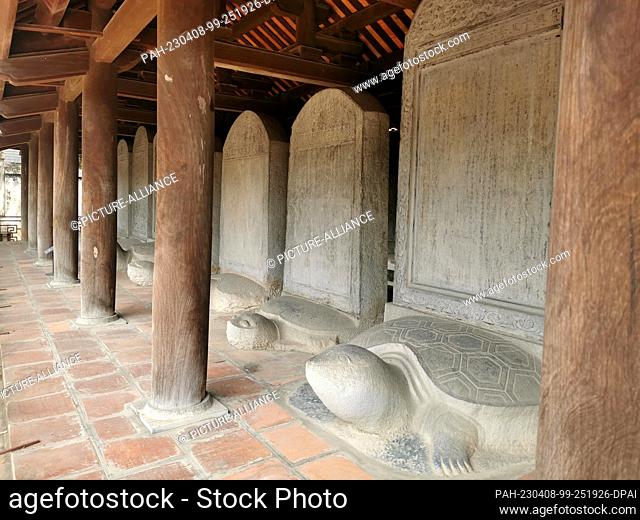 27 February 2023, Vietnam, Hanoi: Stelae stand on the backs of turtles, which are said to embody strength and long life. The stone stelae bear the names of...