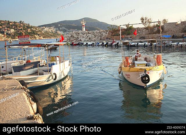Daily excursion boat turning back from the trip to the port of Kalkan at the afternoon light, Antalya Province, Mediterranean Coast, Ancient Lycia Region