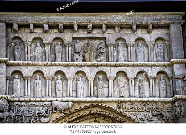 Christ in Majesty, flanked by symbols of Evangelistas, and by Apostoles. Detail of main portal of Romanesque Church Santa María la Real in medieval town...